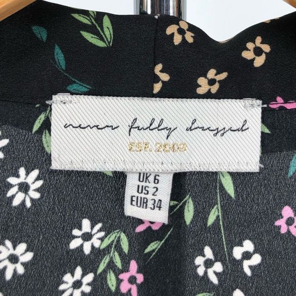 Never Fully Dressed Black Meadow Floral Tie Neck Long Sleeve Cinched Cuff Top 2 - Picture 10 of 12